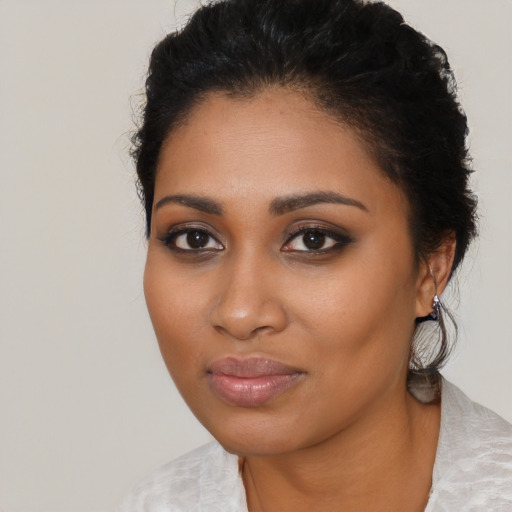 Neutral black young-adult female with medium  brown hair and brown eyes