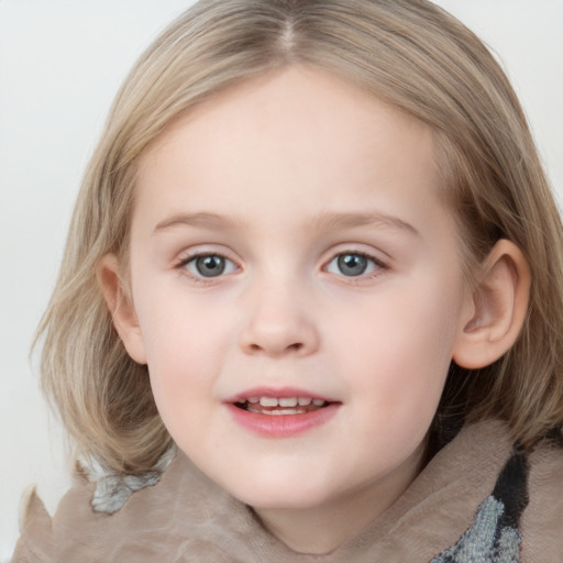 Joyful white child female with medium  brown hair and blue eyes