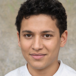 Joyful latino young-adult male with short  brown hair and brown eyes