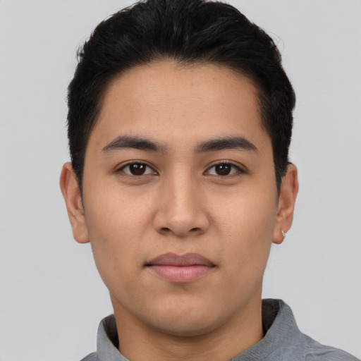 Neutral latino young-adult male with short  black hair and brown eyes