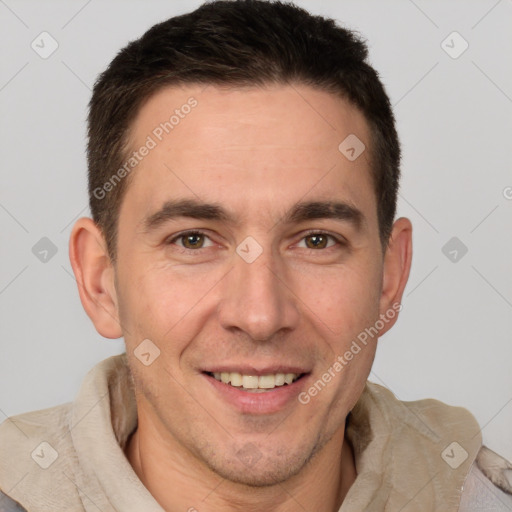 Joyful white adult male with short  brown hair and brown eyes