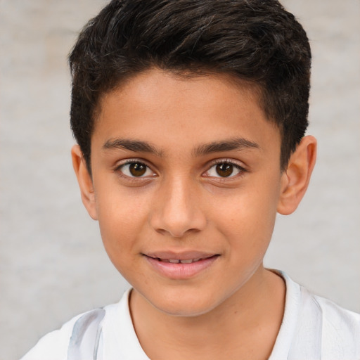 Joyful white child male with short  brown hair and brown eyes