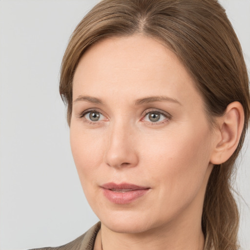 Joyful white young-adult female with long  brown hair and grey eyes