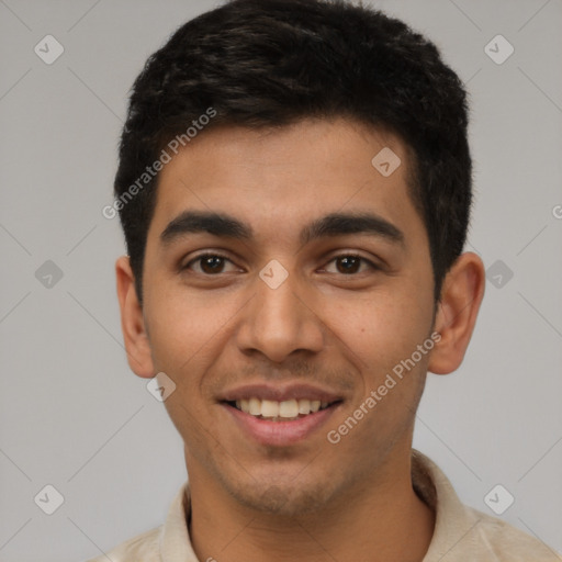 Joyful latino young-adult male with short  black hair and brown eyes