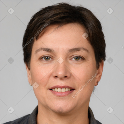 Joyful white adult female with short  brown hair and brown eyes