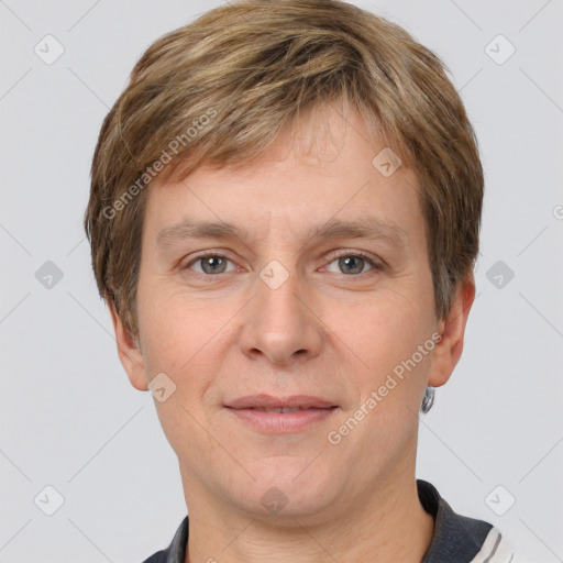 Joyful white adult male with short  brown hair and grey eyes