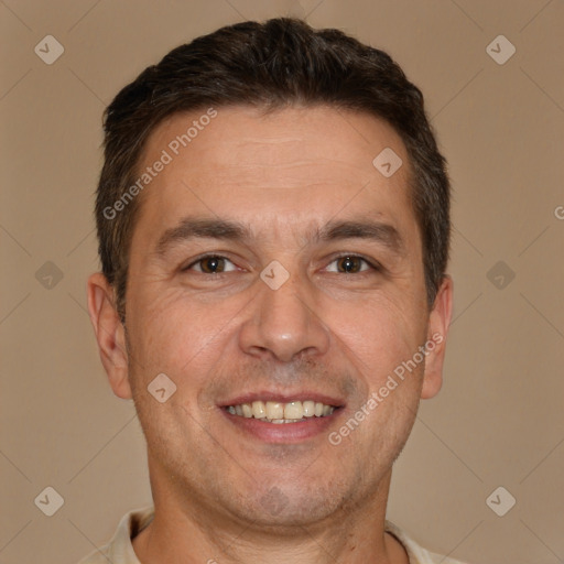 Joyful white adult male with short  brown hair and brown eyes