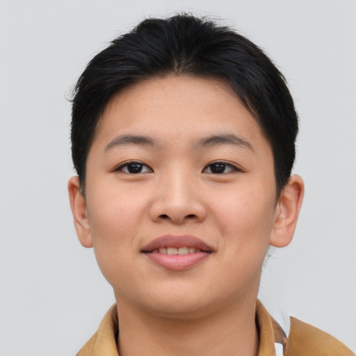 Joyful asian young-adult female with short  brown hair and brown eyes