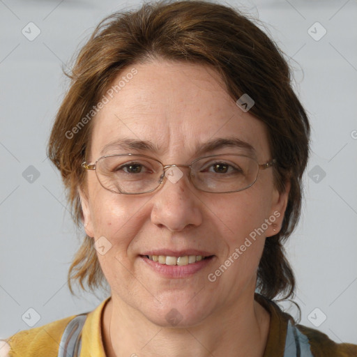 Joyful white adult female with medium  brown hair and blue eyes