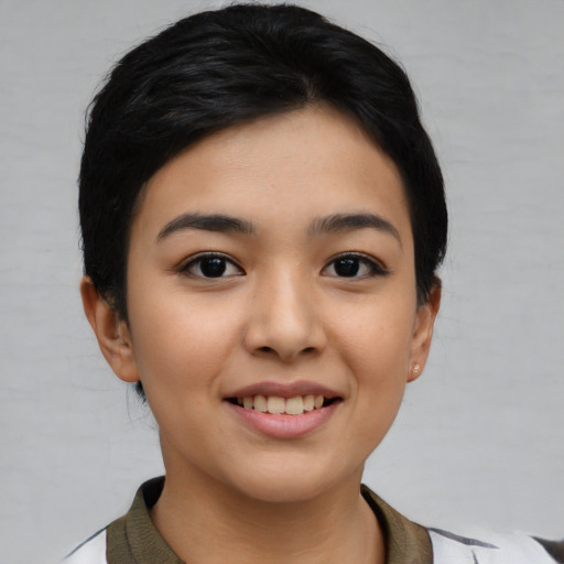 Joyful asian young-adult female with short  brown hair and brown eyes