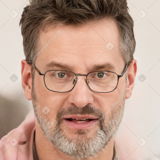 Joyful white adult male with short  brown hair and grey eyes