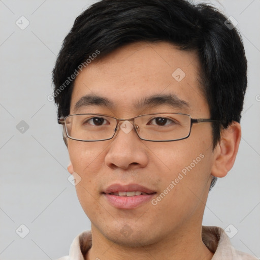 Joyful asian young-adult male with short  brown hair and brown eyes