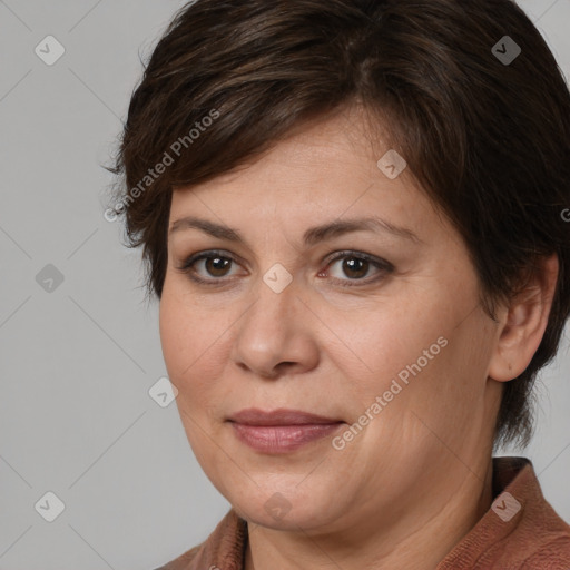 Joyful white adult female with medium  brown hair and brown eyes