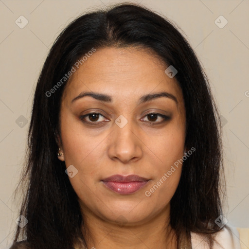 Joyful latino young-adult female with long  brown hair and brown eyes