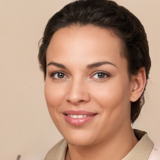 Joyful white young-adult female with medium  brown hair and brown eyes