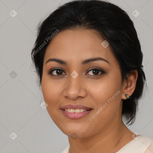 Joyful latino young-adult female with medium  brown hair and brown eyes