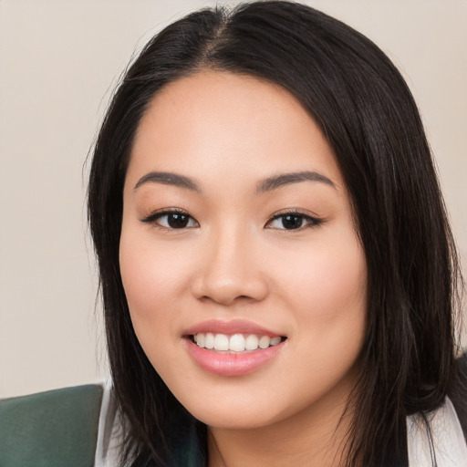 Joyful white young-adult female with long  black hair and brown eyes