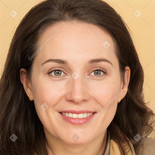 Joyful white adult female with long  brown hair and brown eyes