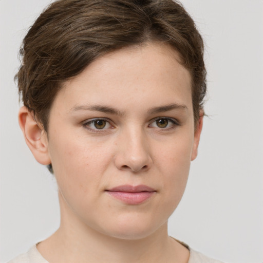 Joyful white young-adult female with short  brown hair and green eyes