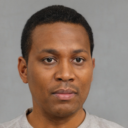 Neutral black young-adult male with short  brown hair and brown eyes