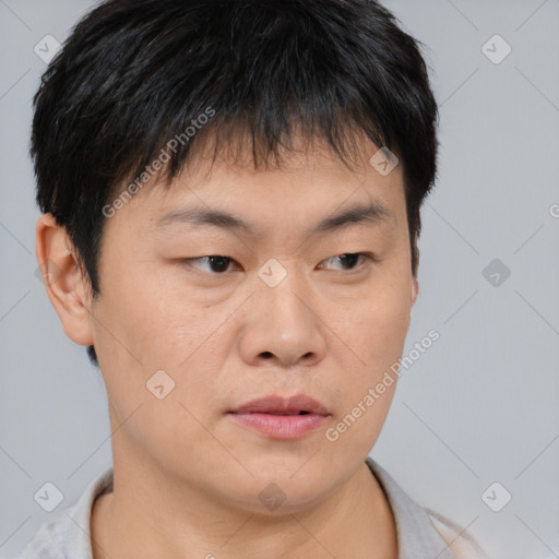 Neutral asian young-adult male with short  brown hair and brown eyes