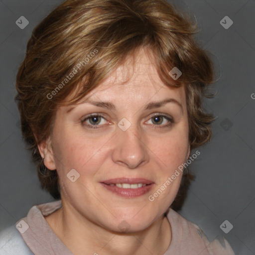 Joyful white adult female with medium  brown hair and blue eyes