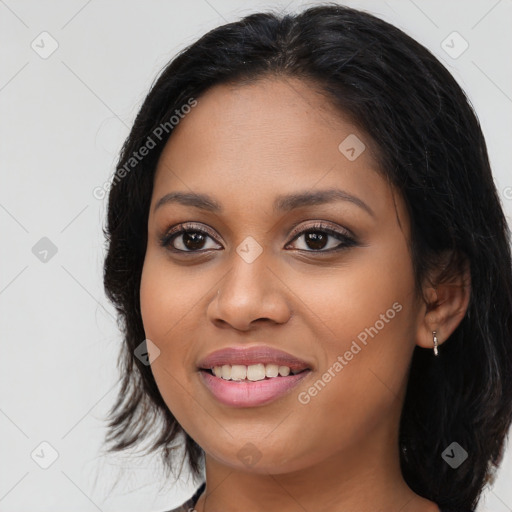 Joyful latino young-adult female with long  black hair and brown eyes