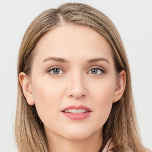 Joyful white young-adult female with long  brown hair and grey eyes