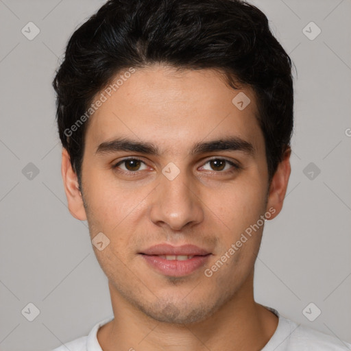 Joyful white young-adult male with short  black hair and brown eyes