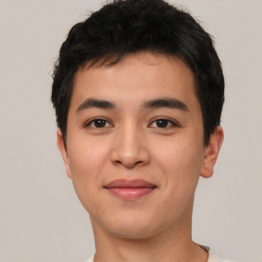 Joyful asian young-adult male with short  brown hair and brown eyes