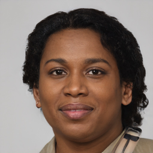Joyful latino young-adult female with short  black hair and brown eyes