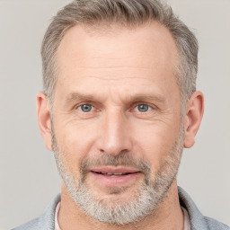 Joyful white middle-aged male with short  brown hair and brown eyes