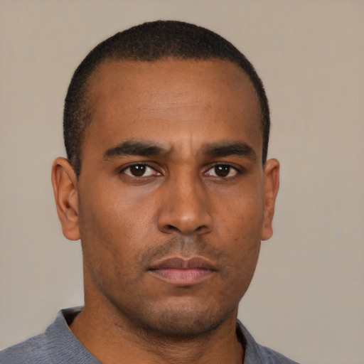 Neutral black young-adult male with short  black hair and brown eyes