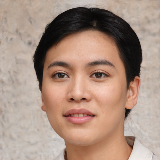 Joyful asian young-adult female with short  black hair and brown eyes