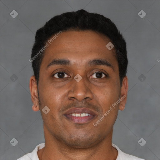 Joyful latino young-adult male with short  black hair and brown eyes