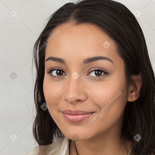 Joyful latino young-adult female with long  brown hair and brown eyes