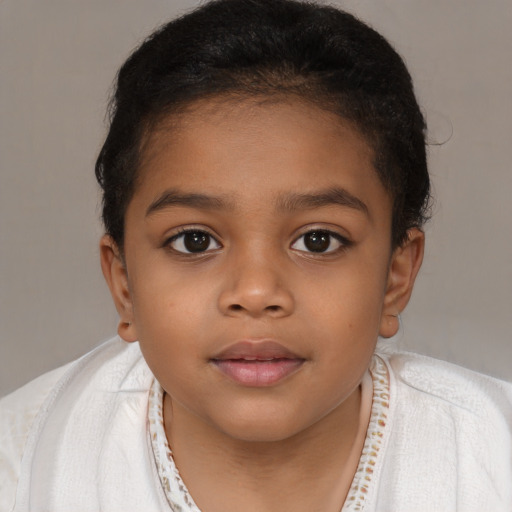 Joyful latino child female with short  brown hair and brown eyes
