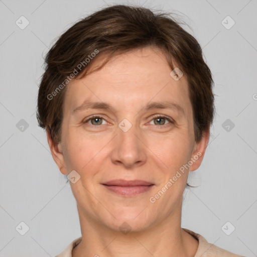 Joyful white adult female with short  brown hair and grey eyes