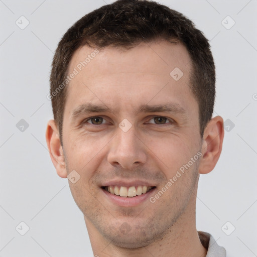 Joyful white young-adult male with short  brown hair and brown eyes