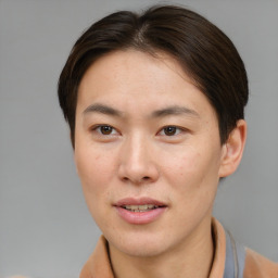 Joyful asian young-adult female with short  brown hair and brown eyes