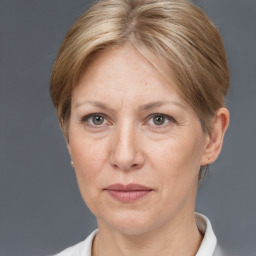 Joyful white adult female with short  brown hair and grey eyes