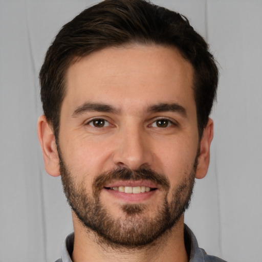 Joyful white young-adult male with short  brown hair and brown eyes