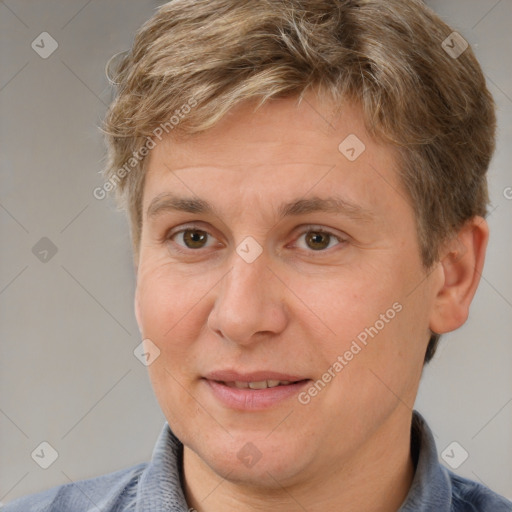 Joyful white adult male with short  brown hair and brown eyes