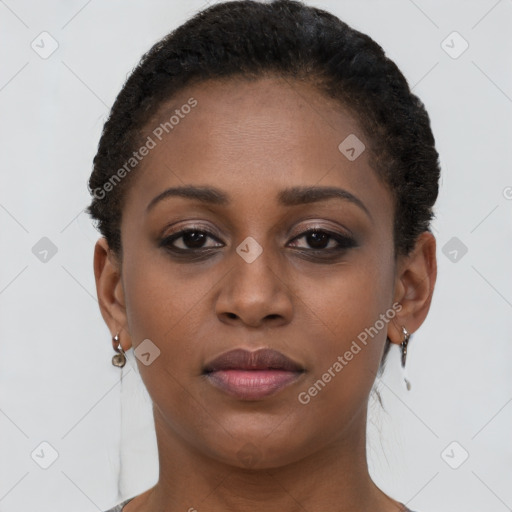 Joyful black young-adult female with short  brown hair and brown eyes