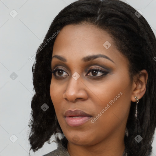 Joyful black young-adult female with long  black hair and brown eyes