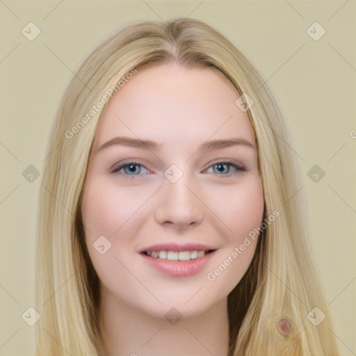 Joyful white young-adult female with long  brown hair and blue eyes