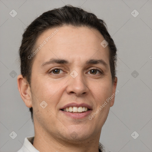 Joyful white adult male with short  brown hair and brown eyes