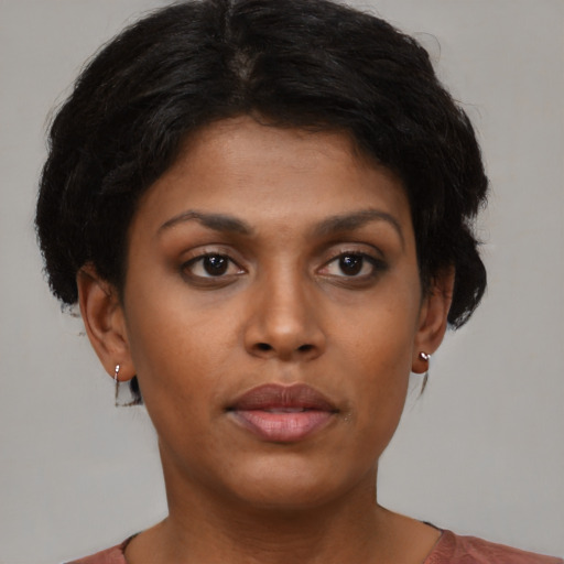 Neutral black young-adult female with short  brown hair and brown eyes
