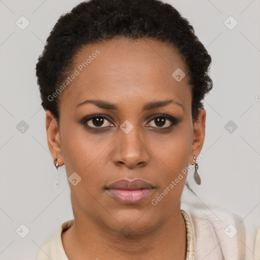 Joyful black young-adult female with short  brown hair and brown eyes