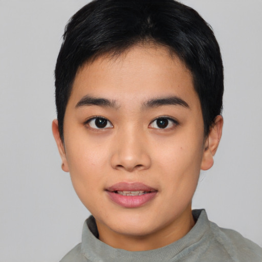 Joyful asian young-adult female with short  black hair and brown eyes